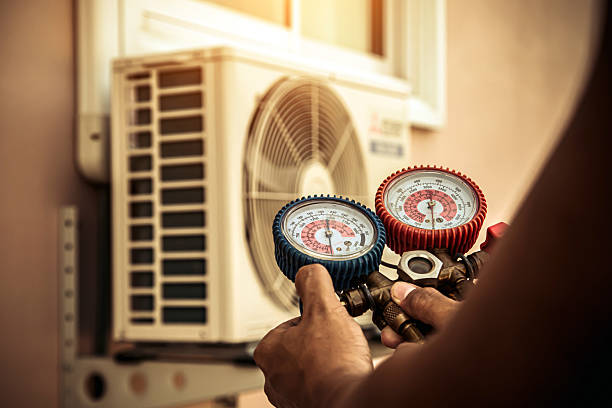 Professional Air Conditioning Service technician working in Mitchell, IL